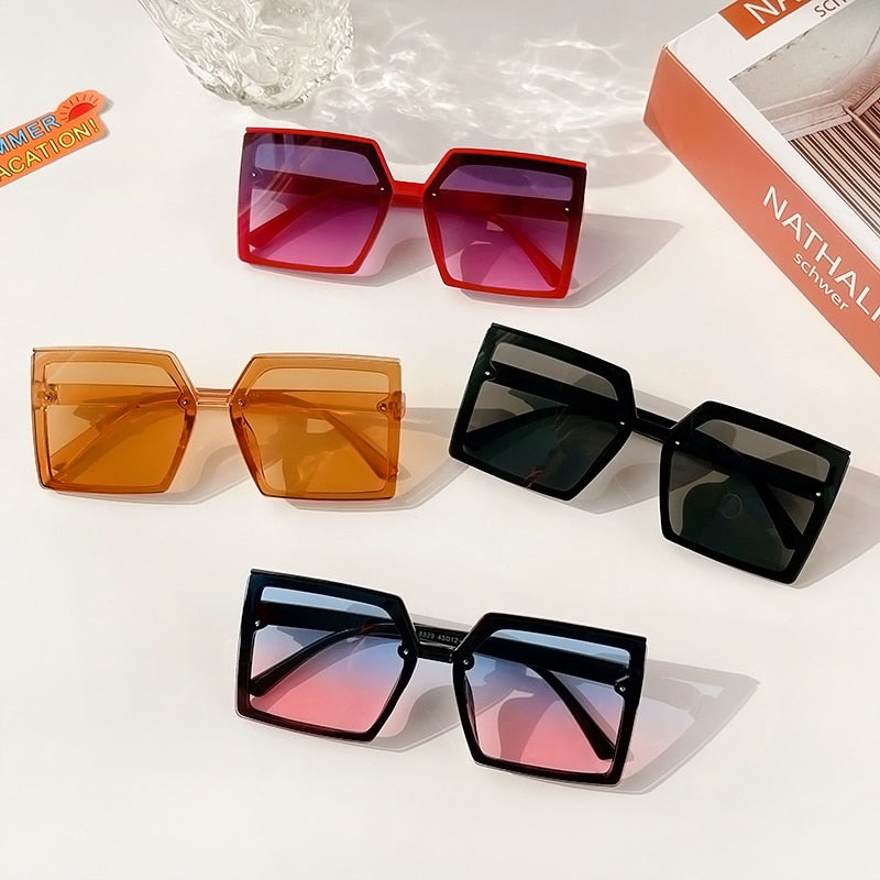 Stylish geometric rectangle sunglasses for girls, offering UV eye protection and a comfort fit for kids.