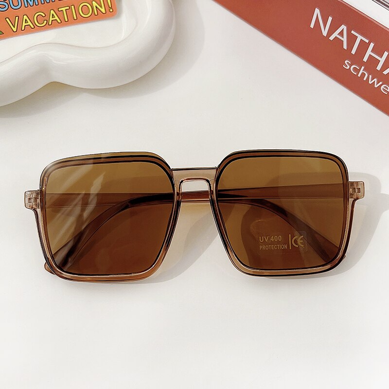 Rectangle geometric girls' sunglasses, a fashionable kids eyewear choice with UV protection.