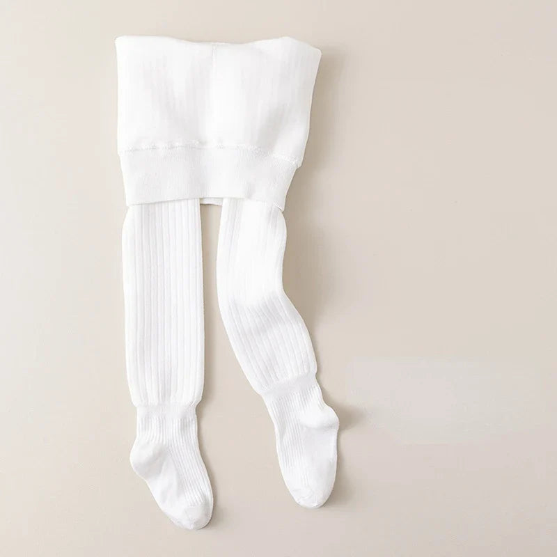 Flat lay of girls' cotton fleece-lined leggings ready for cold weather