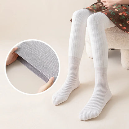 Close-up of soft cotton fleece lining inside girls' winter leggings, cozy & warm