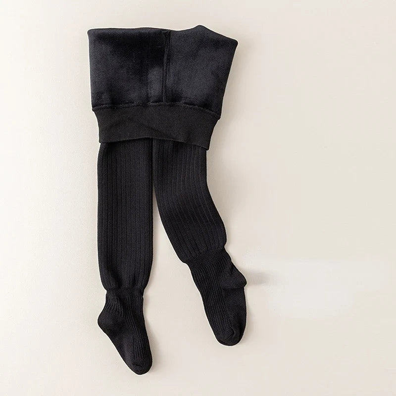 Detail of fabric texture on thick fleece-lined baby leggings, warm & soft