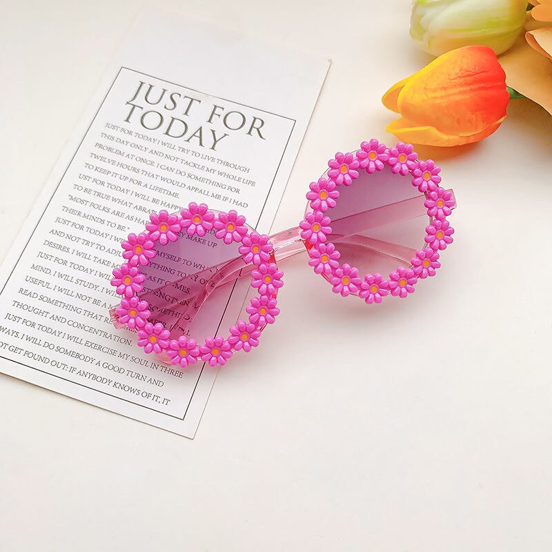 Close-up on mirrored lenses of girls' sunglasses, providing UV protection for kids' eyes