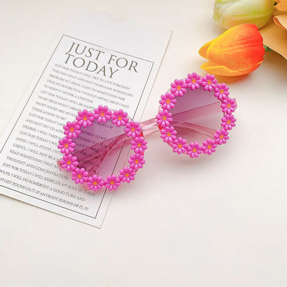 Close-up on mirrored lenses of girls' sunglasses, providing UV protection for kids' eyes