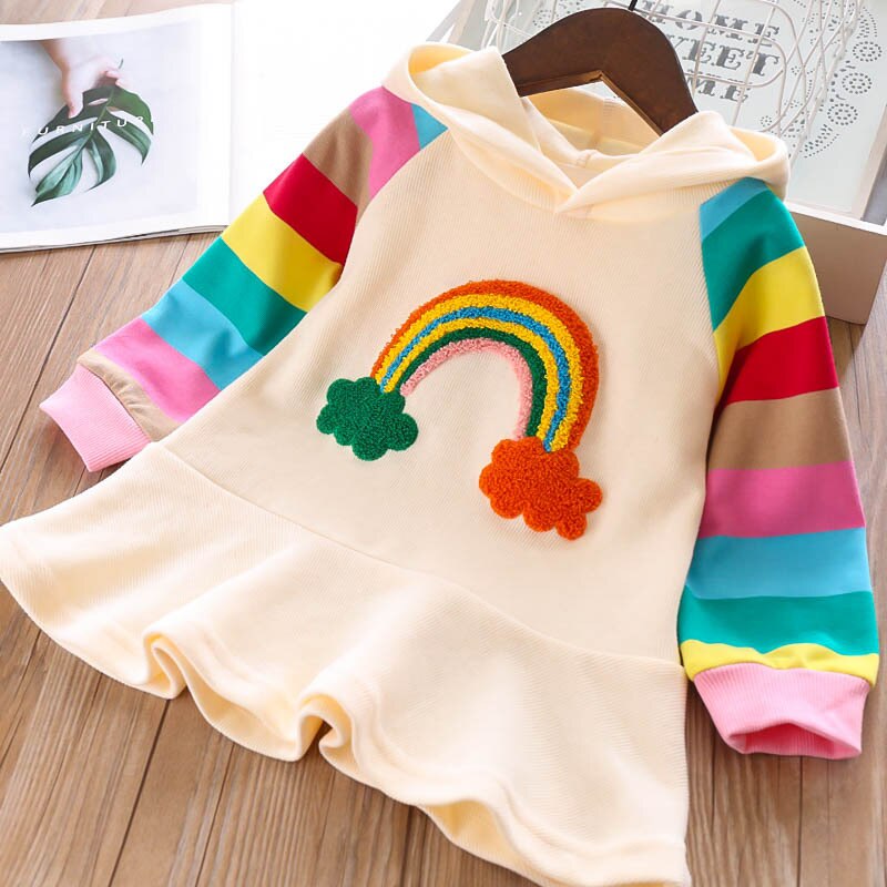 Bright pink knit unicorn sweater top attached to a flowing rainbow mesh toddler dress
