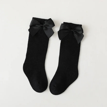 Girls' grey cotton knee-high bow socks; versatile children's apparel accessory