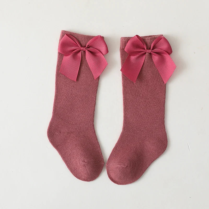 Girls' pale yellow cotton knee-high bow socks; sweet baby apparel for warm weather