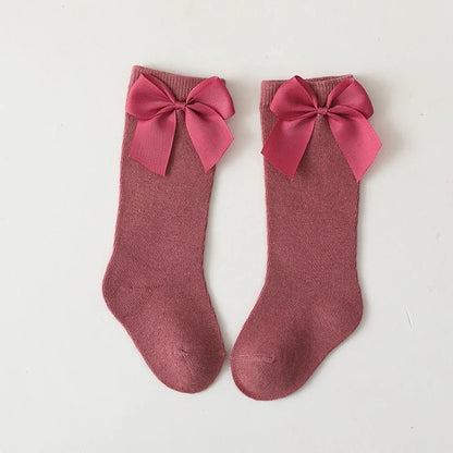 Girls' pale yellow cotton knee-high bow socks; sweet baby apparel for warm weather