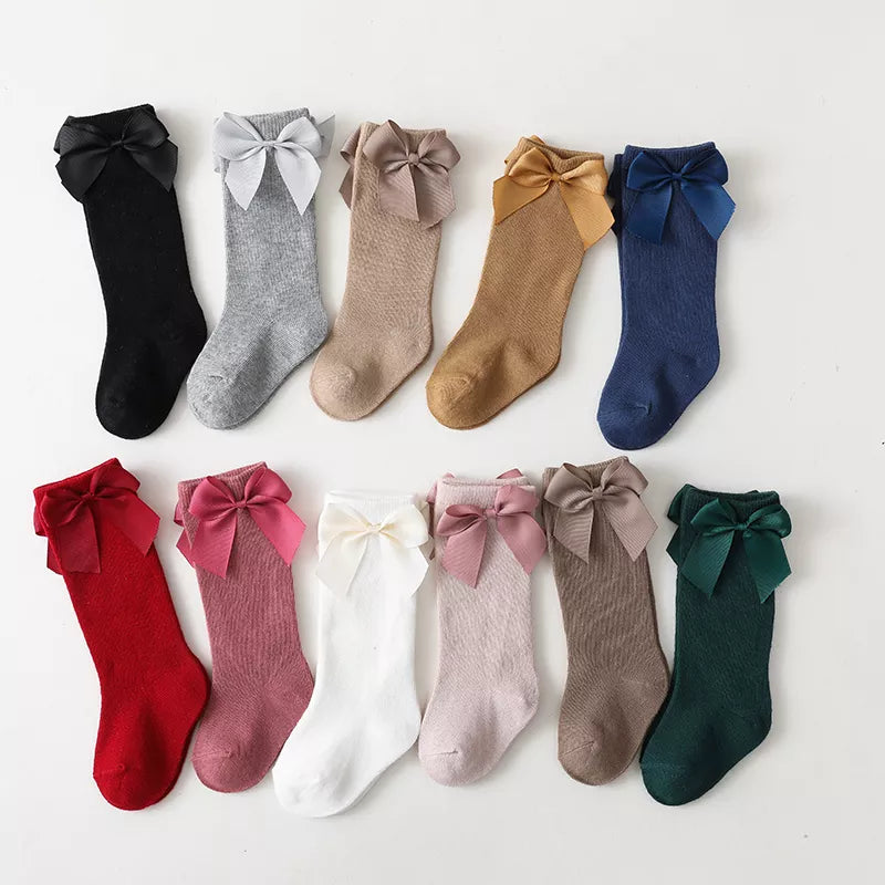 Girls' light blue cotton knee-high bow socks; charming children's apparel