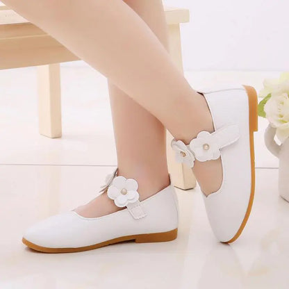 Girls white leather princess sandals with buckle strap, elegant and perfect for weddings.