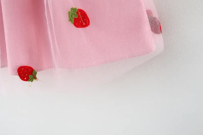 Kids' fashion: White embroidered strawberry dress with a bow, light and breezy for summer.