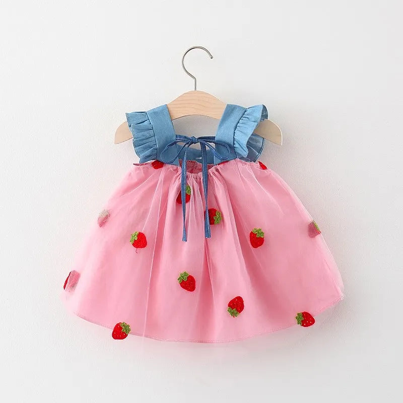 Children's white party dress with sweet strawberry embroidery and a bow, perfect for special occasions.