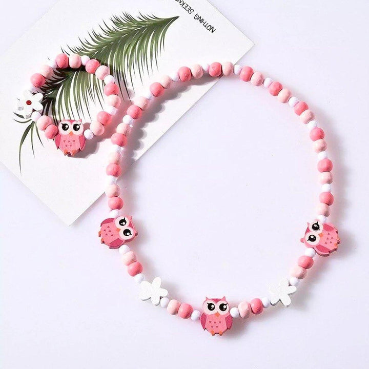 Stylish girls' jewelry set: wooden animal charm necklace & bracelet, ideal for baby accessories.