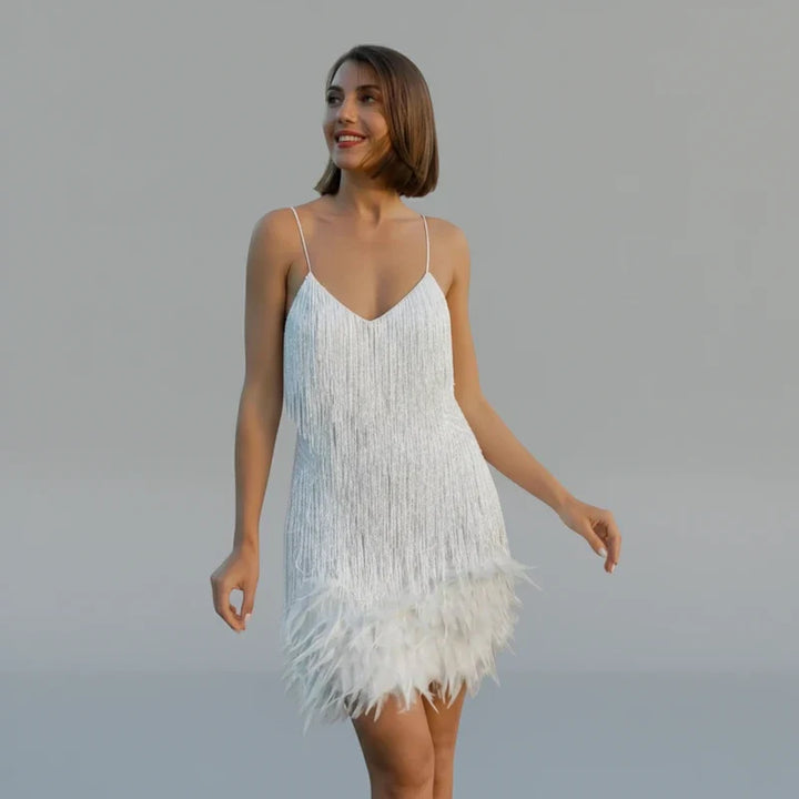 Women's chic spaghetti strap bodycon mini dress with glamorous fringe detailing for special occasions.