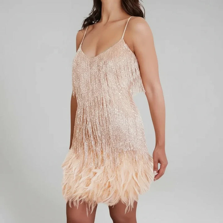 Fashionable women's mini dress with glamorous fringe and bodycon fit, versatile for parties and club nights.