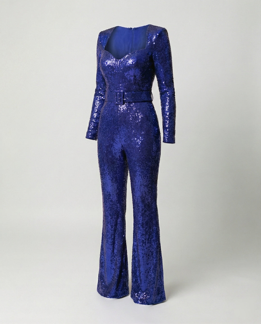 Elegant women's sequin jumpsuit, long sleeves, ideal glamorous party outfit or formal evening wear for special occasions.