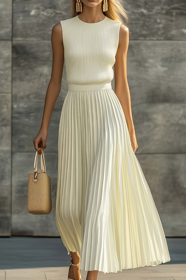 Graceful women's pleated sleeveless midi dress, perfect for elegant summer days or vacation. Flowy, relaxed fit.