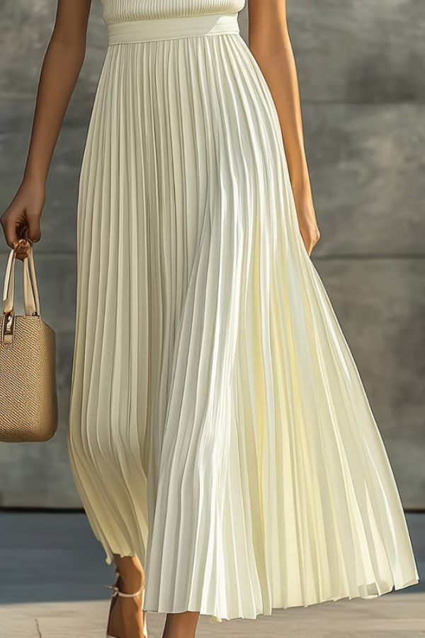 Versatile women's pleated midi dress, sleeveless for summer. Perfect elegant casual day dress or vacation outfit.