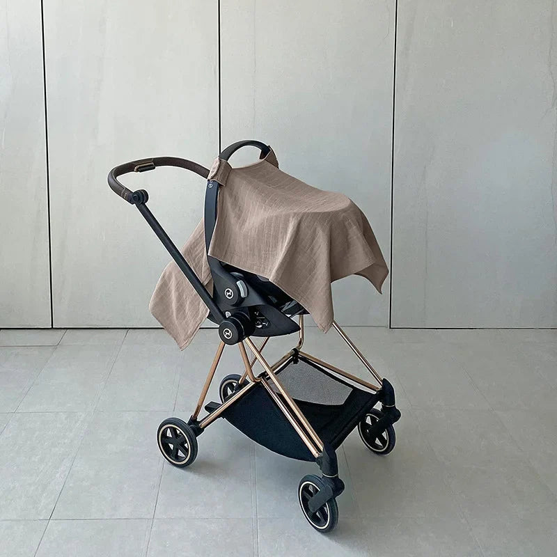 Green baby stroller with sun shade deployed, offering full sun and wind protection for baby.