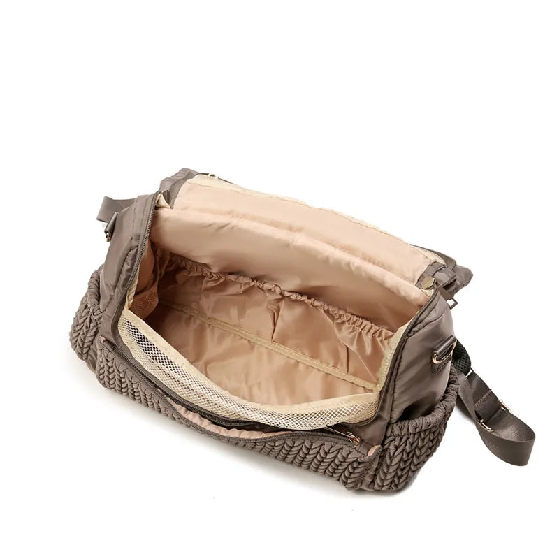 Gray waterproof mommy backpack set displayed on a neutral background, essential baby transport