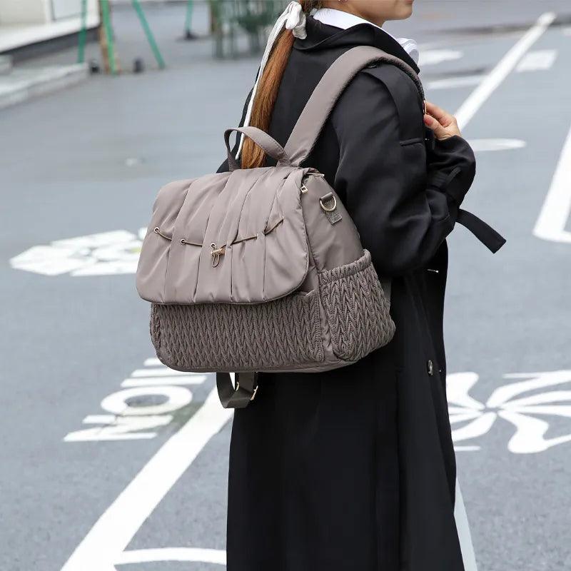 Stylish gray nylon mommy backpack and matching baby bottle bags, parenting essentials