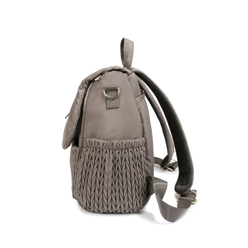 Side view of the spacious gray waterproof diaper bag, perfect for baby transport