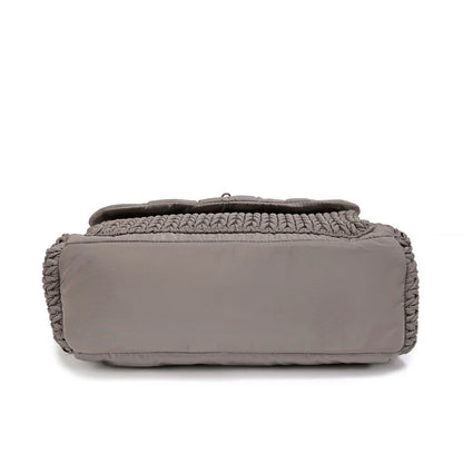 Close-up of the waterproof fabric on the gray mommy backpack set, durable nylon