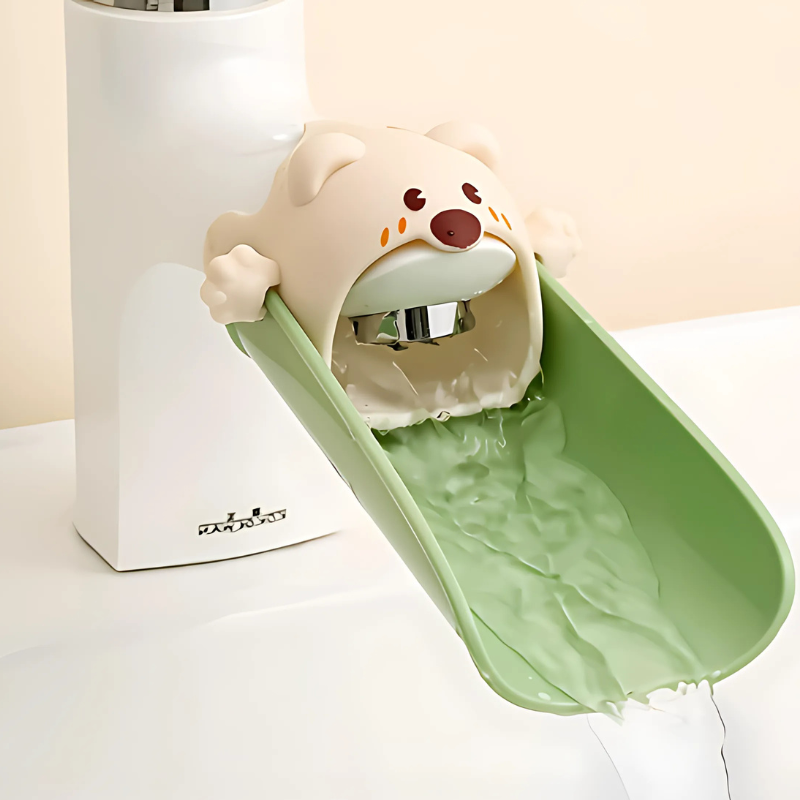 Green BPA-free children's faucet extender, making handwashing easier for toddlers, easy install bathroom accessory.