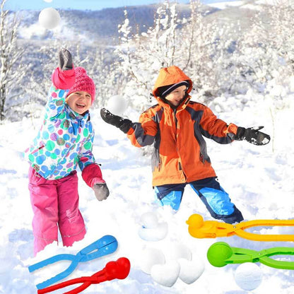 Happy child holding snowballs made with unique snowball maker clips, enjoying winter outdoor play.