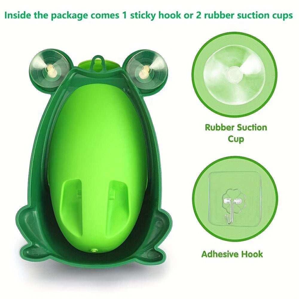 Toddler boy learning to use a frog shaped potty training urinal with spinning target
