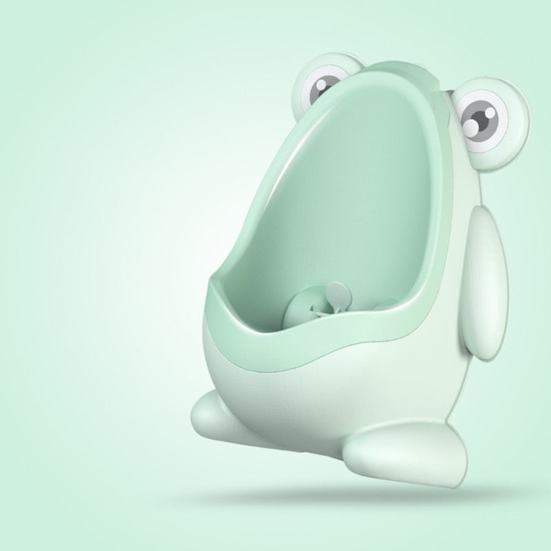 Green froggy potty training urinal with windmill spinner, perfect for toddlers learning to stand.