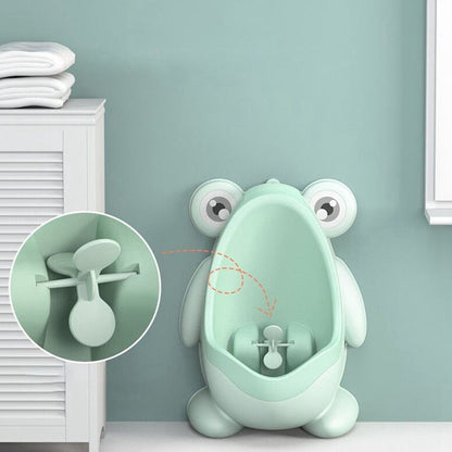Child-friendly green froggy potty training urinal featuring a playful windmill, for safe childcare.