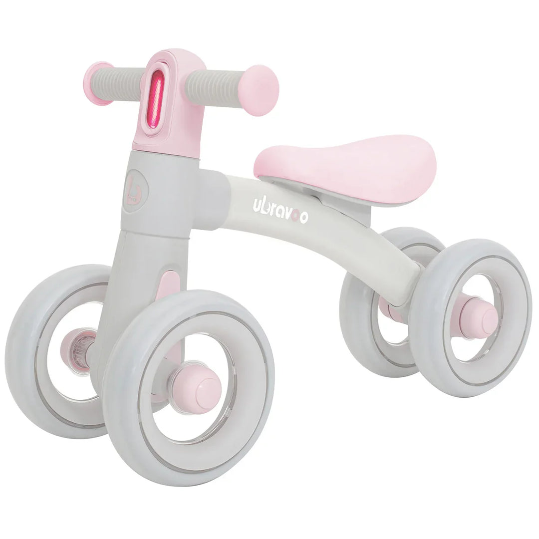 Front view of green balance bike for 12-24 months, showcasing its bright headlight, seat & silent wheels.