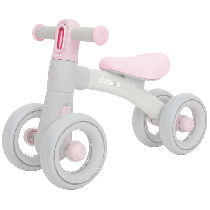 Front view of green balance bike for 12-24 months, showcasing its bright headlight, seat & silent wheels.