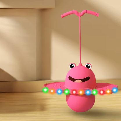 Image showcasing the adjustable handle and foam base of a pink kids' pogo stick