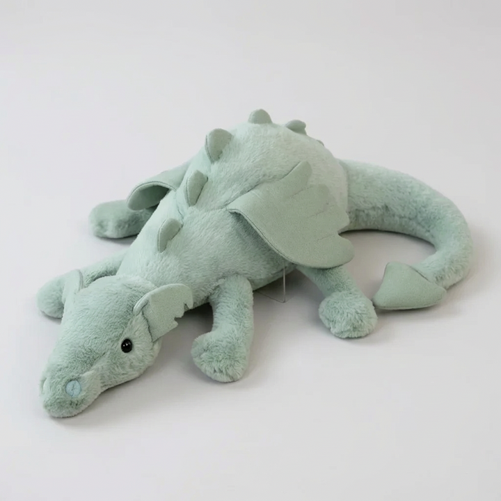 Green plush dragon toy, soft & cuddly for children's imaginative play. Stuffed animal gift, perfect for fantasy room decor.
