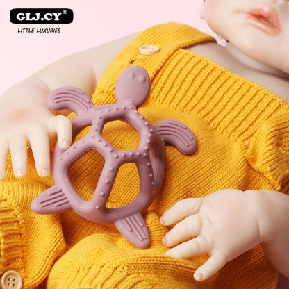 Ergonomic silicone turtle teether designed for baby's small hands and soothing gums