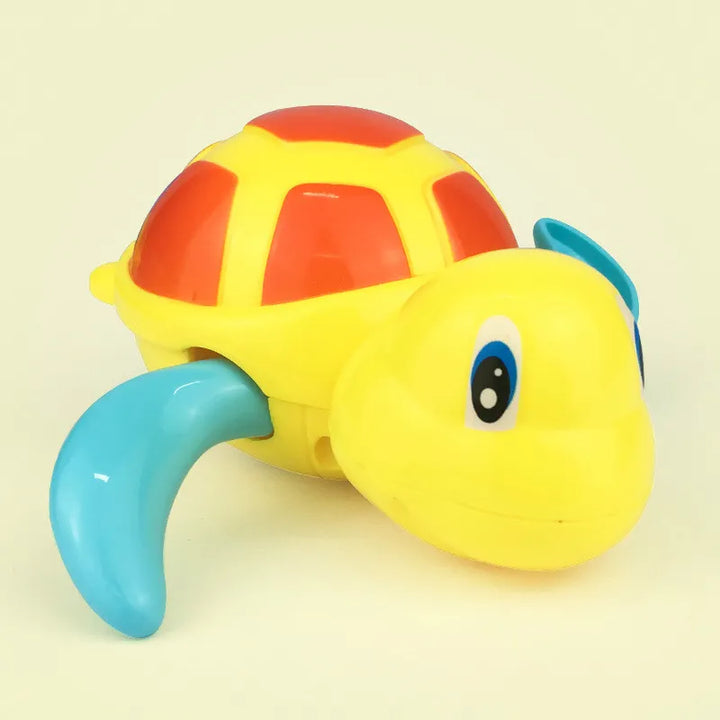 Various wind-up swimming turtle bath toys lined up, showcasing the variety of colors for kids' play