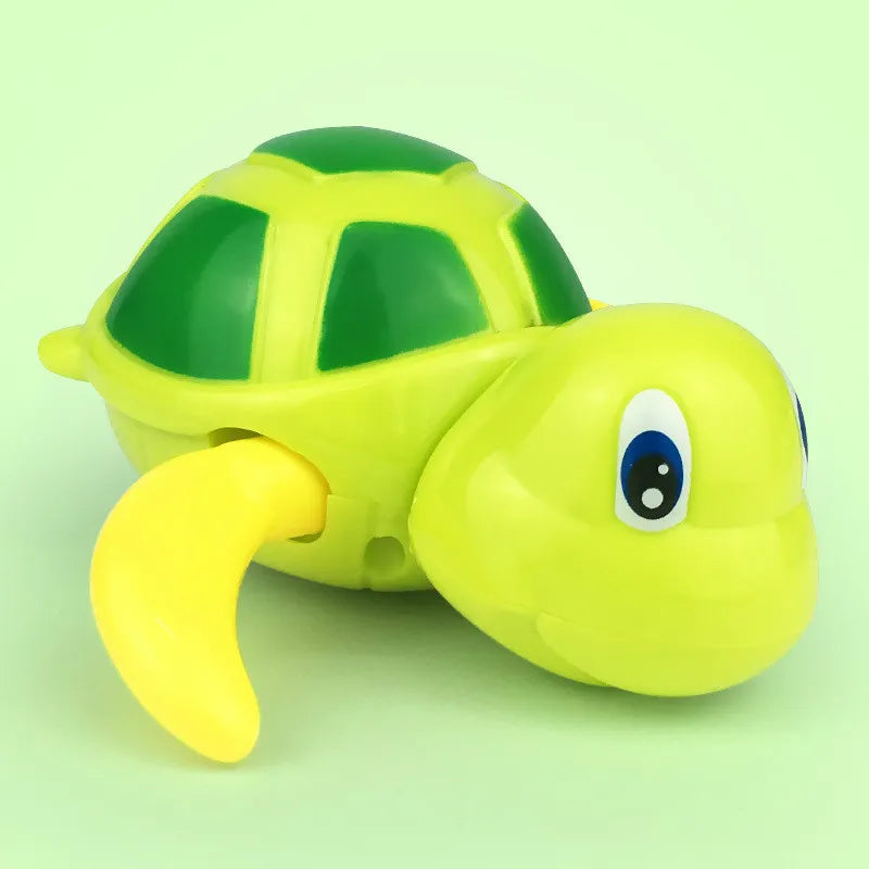 Close-up of a wind-up swimming turtle bath toy, showing winding mechanism, fun for baby bath