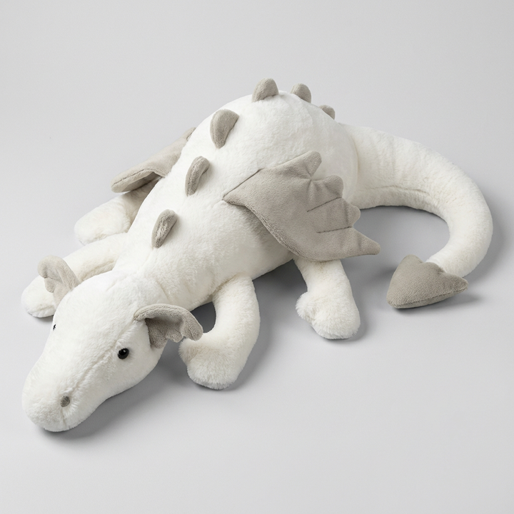 Colorful green, blue, pink winged dragon plush toy. Soft fantasy stuffed animal, great for kids' playtime.