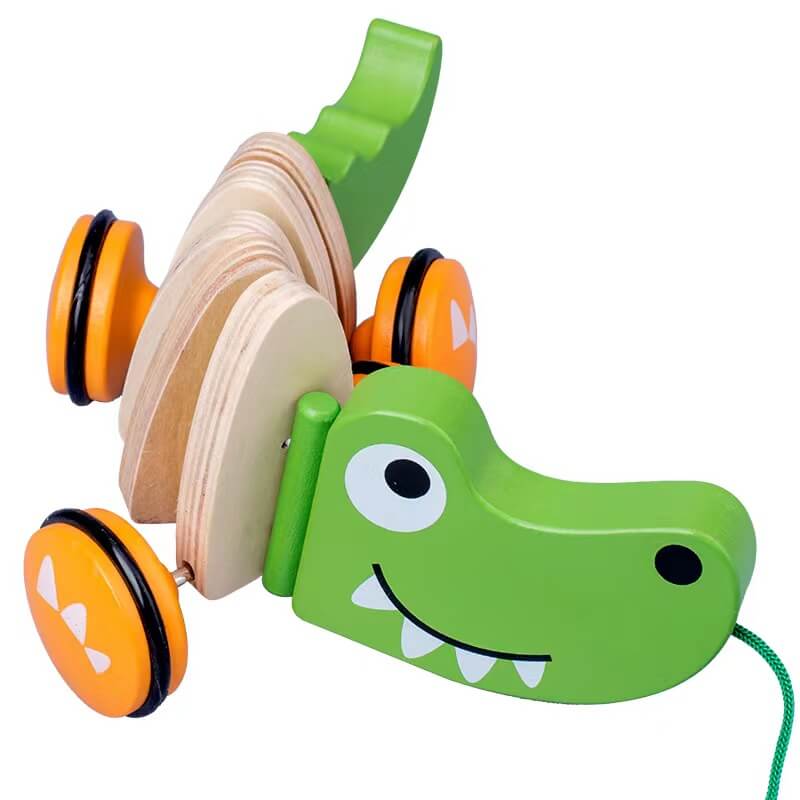 Playful wooden pull-along crocodile toy for toddlers, featuring a friendly design and durable construction.
