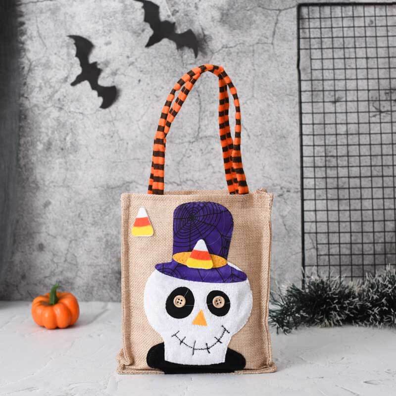 Eco-friendly linen Halloween treat bag with a friendly mummy design, ideal for holding holiday sweets