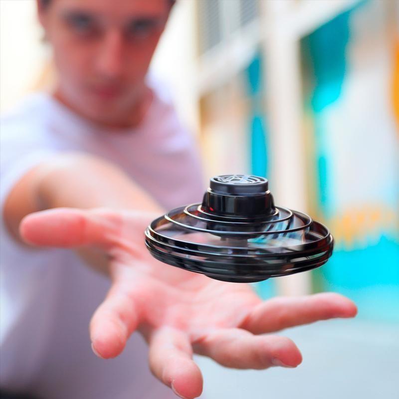 Rechargeable hand controlled mini drone flying toy with vibrant LED lights, perfect for kids' indoor fun.