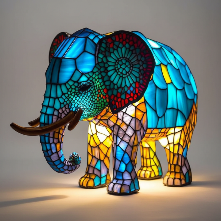 Gleaming mosaic animal head lamp, a unique handcrafted table light that brightens any room decor.