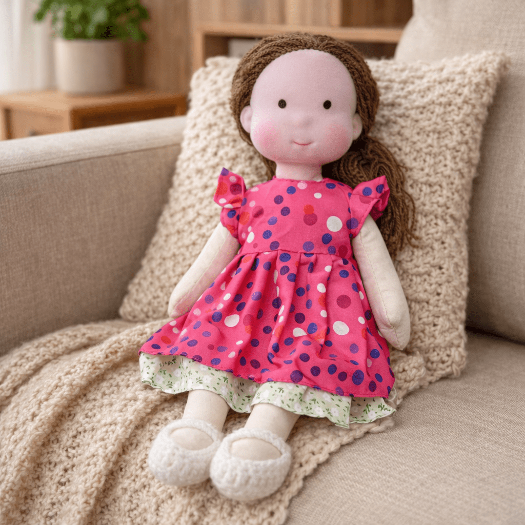 Child-friendly Waldorf doll, a handmade cotton plush with natural materials for play.