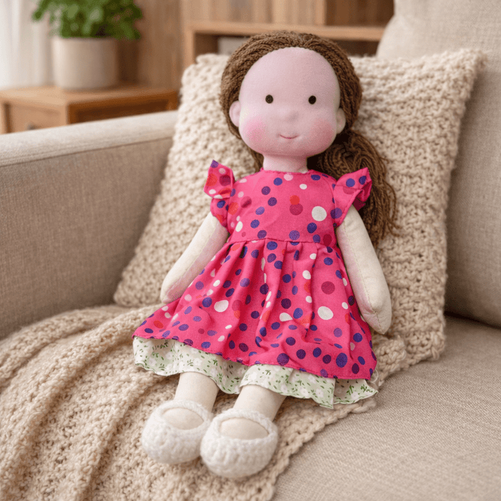 Child-friendly Waldorf doll, a handmade cotton plush with natural materials for play.