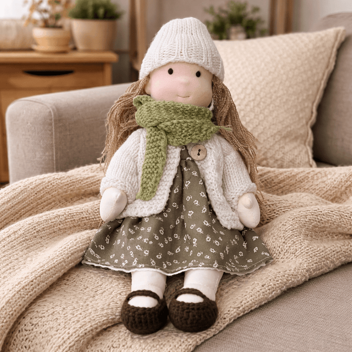Waldorf doll made from natural cotton, a soft and safe plush toy for toddlers.