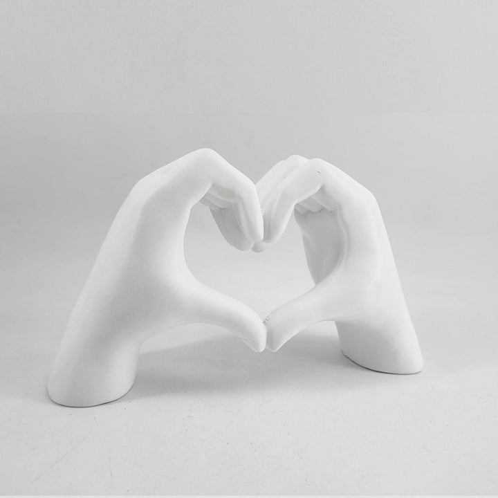 Handcrafted wood heart hands sculpture, a unique love symbol. Modern rustic home decor and art figurine.