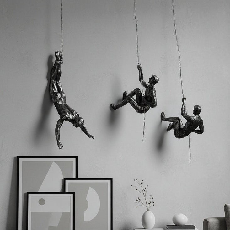 Handmade climber wall art sculpture, dynamic home decor accent.