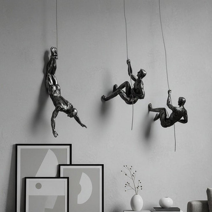 Handmade climber wall art sculpture, dynamic home decor accent.