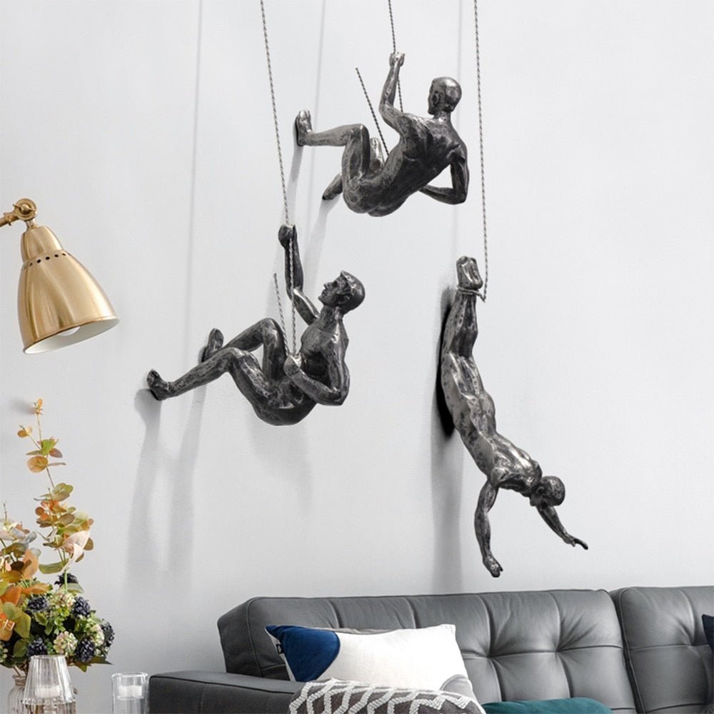 Modern metal-look climber wall sculpture, unique artistic home decor.